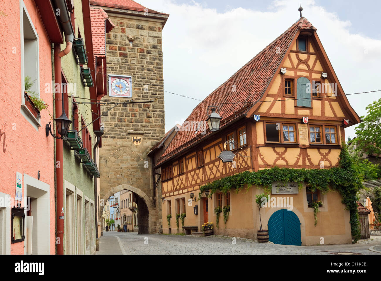 Half timbered building by 14th century Siebersturm Siebers Tower gate entrance to medieval old town on Romantic Road, Rothenburg Stock Photo