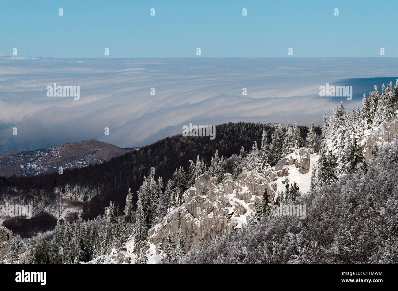 Fog over Lika (region in Croatia, Europe). A photo was taken during winter time from Velebit mountain Stock Photo