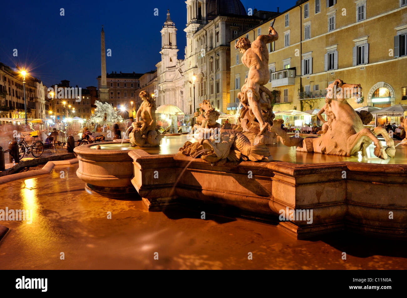 Fontana del Nettuno Fountain of Neptune and Sant'Agnese in Agone basilica church, Piazza Navona square, Rome, Lazio, Italy Stock Photo