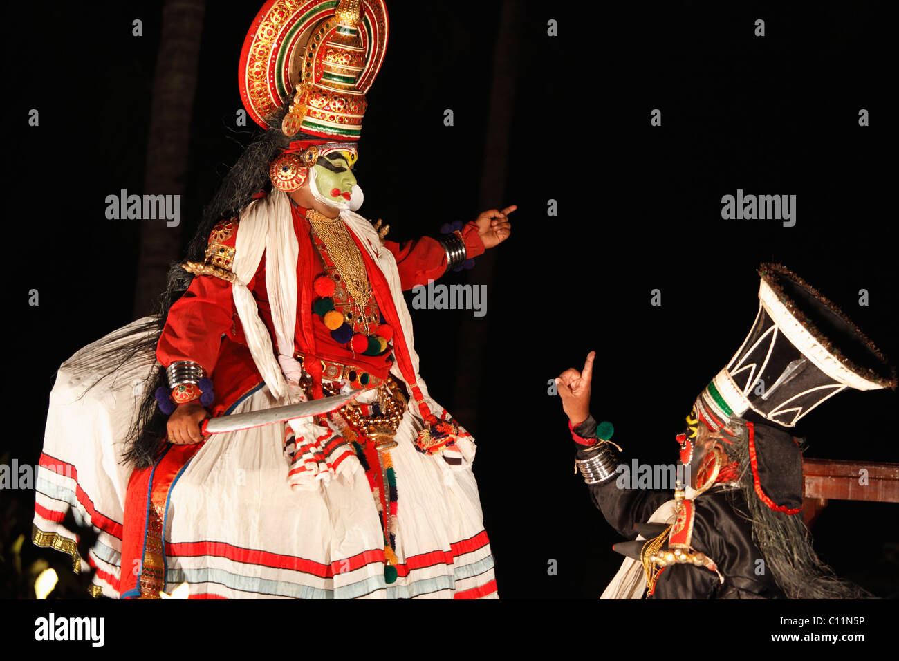 Kathakali dance, Pachcha character with sword and Chuvanna Thaadi character, Kerala, southern India, Asia Stock Photo