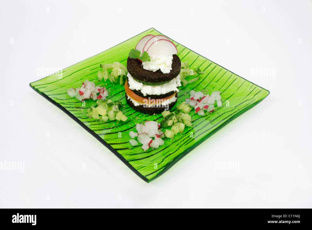 Pumpernickel with cream cheese, tomato, cucumber and radishes Stock