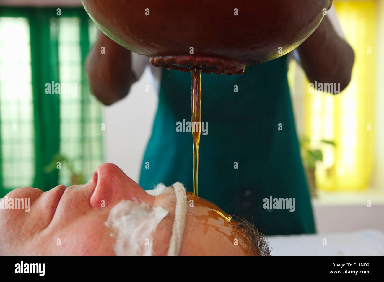 Shirodhara, oil being poured on the forehead, Ayurvedic treatment, Bethsaida Hermitage near Kovalam, , southern India, India Stock Photo