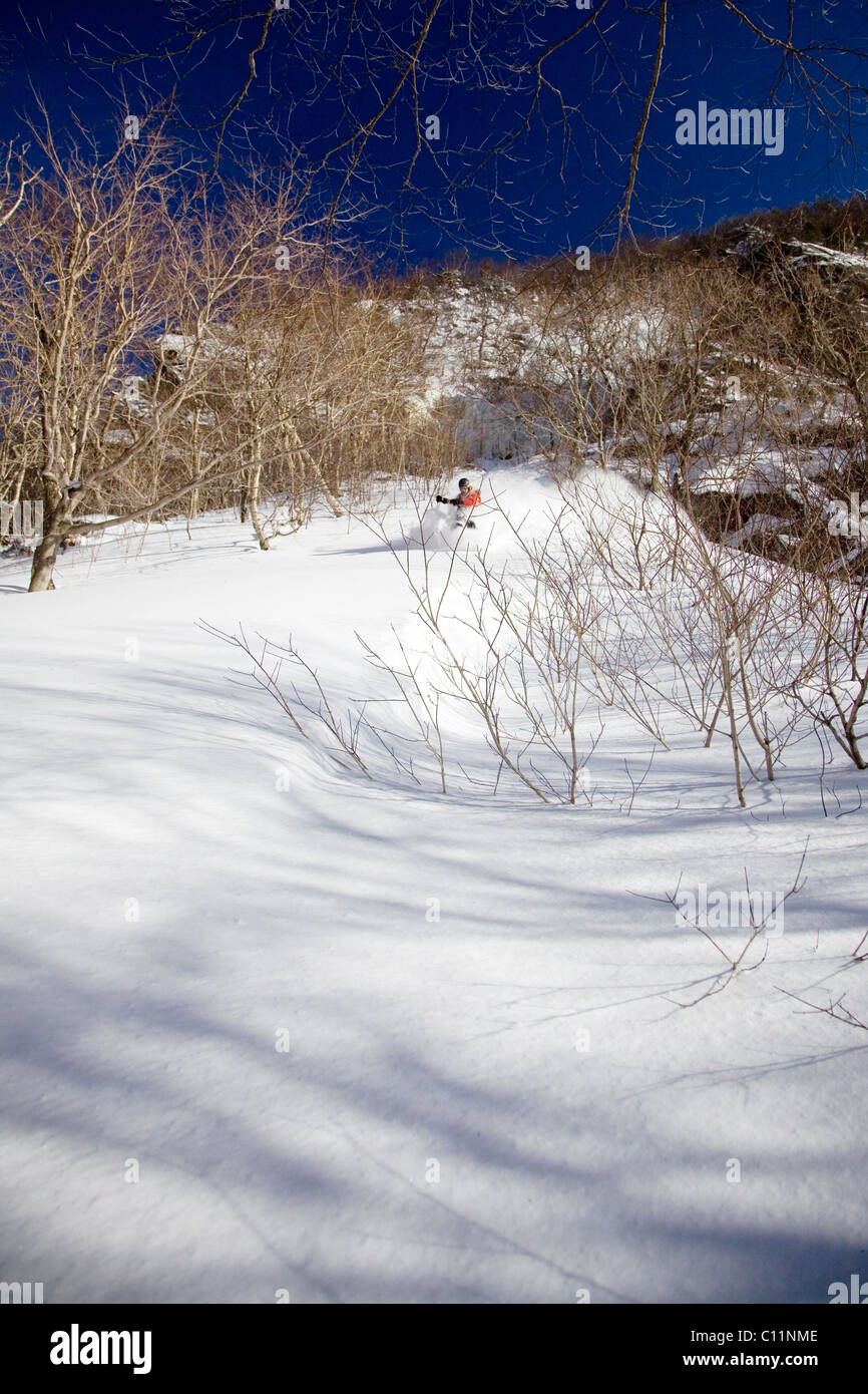 Backcountry skier in the deep snow of Smugglers Notch, Stowe, Vermont Stock Photo