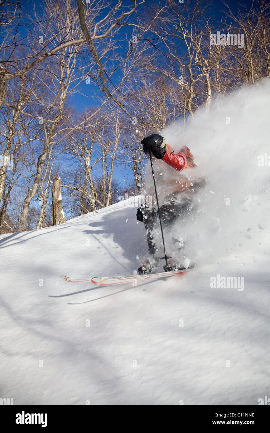 Backcountry skier in the deep snow of Smugglers Notch, Stowe, Vermont Stock Photo