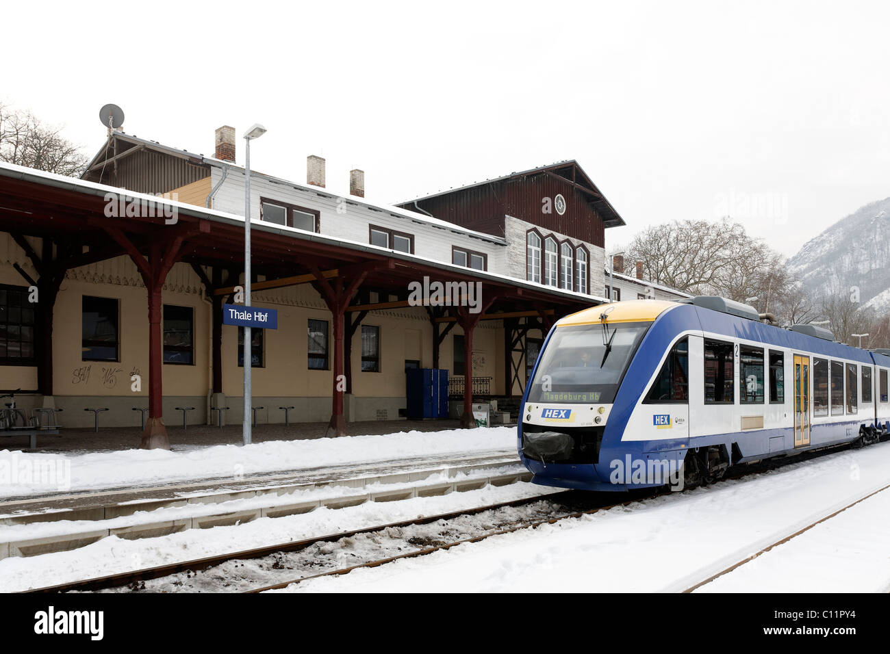 Modern train waiting outside the Wilhelminian style station building, Harz-Elbe-Express, winter, Thale, Harz, Saxony-Anhalt Stock Photo