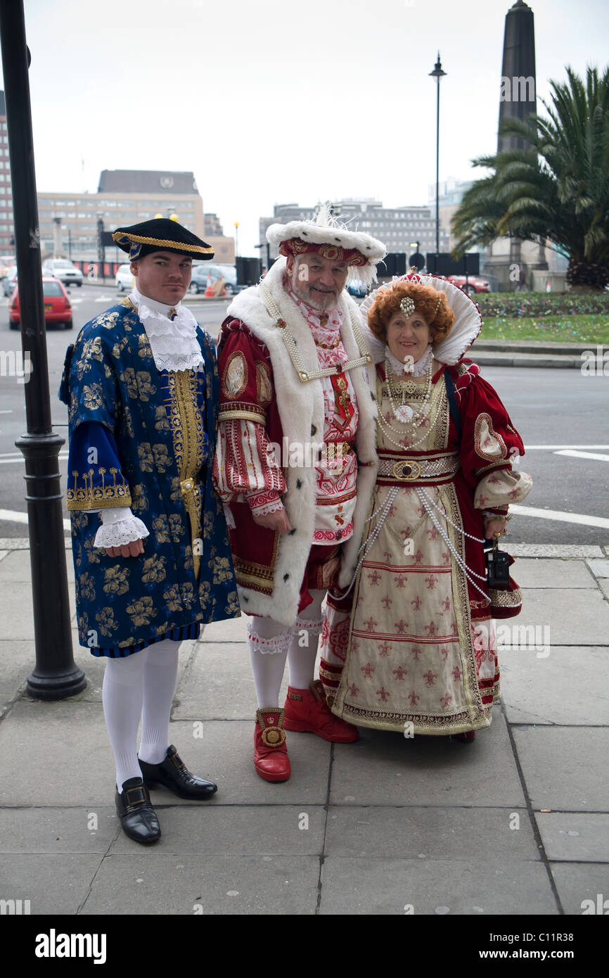 Three adults dressed as Royalty ready to take part in London's New Year's Day Parade Stock Photo