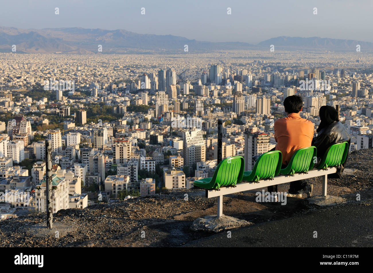 Young Islamic, Iranian couple enjoying the panoramic view over the city of Tehran, Iran, Persia, Asia Stock Photo