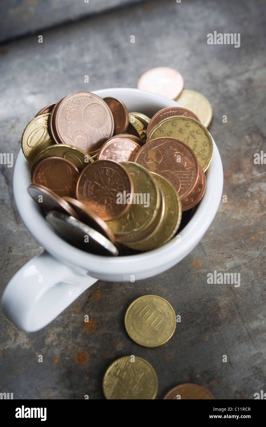 Coffee cup and euro coins Stock Photo