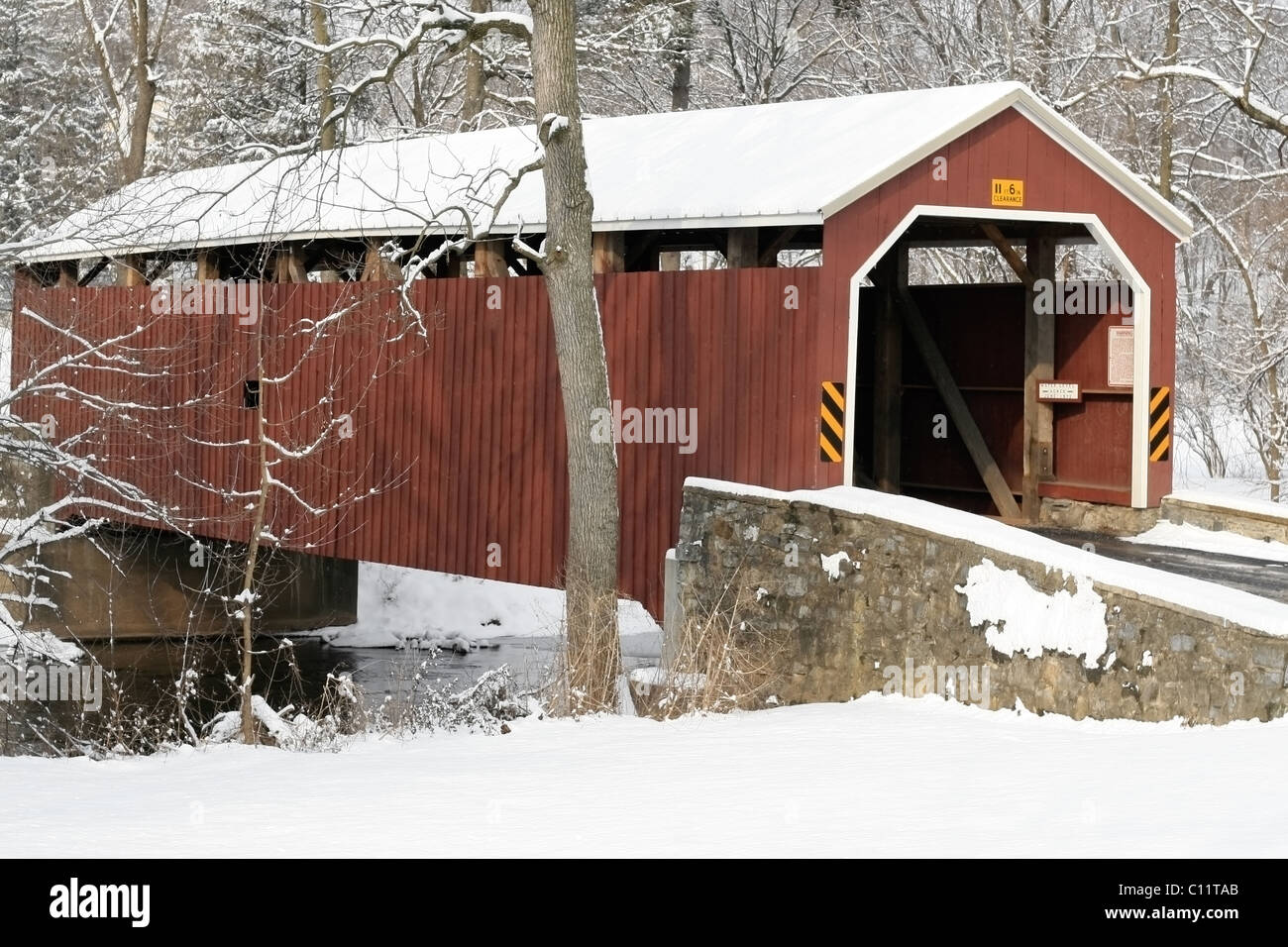 Covered bridge under the snow in Lancaster PA USA Stock Photo