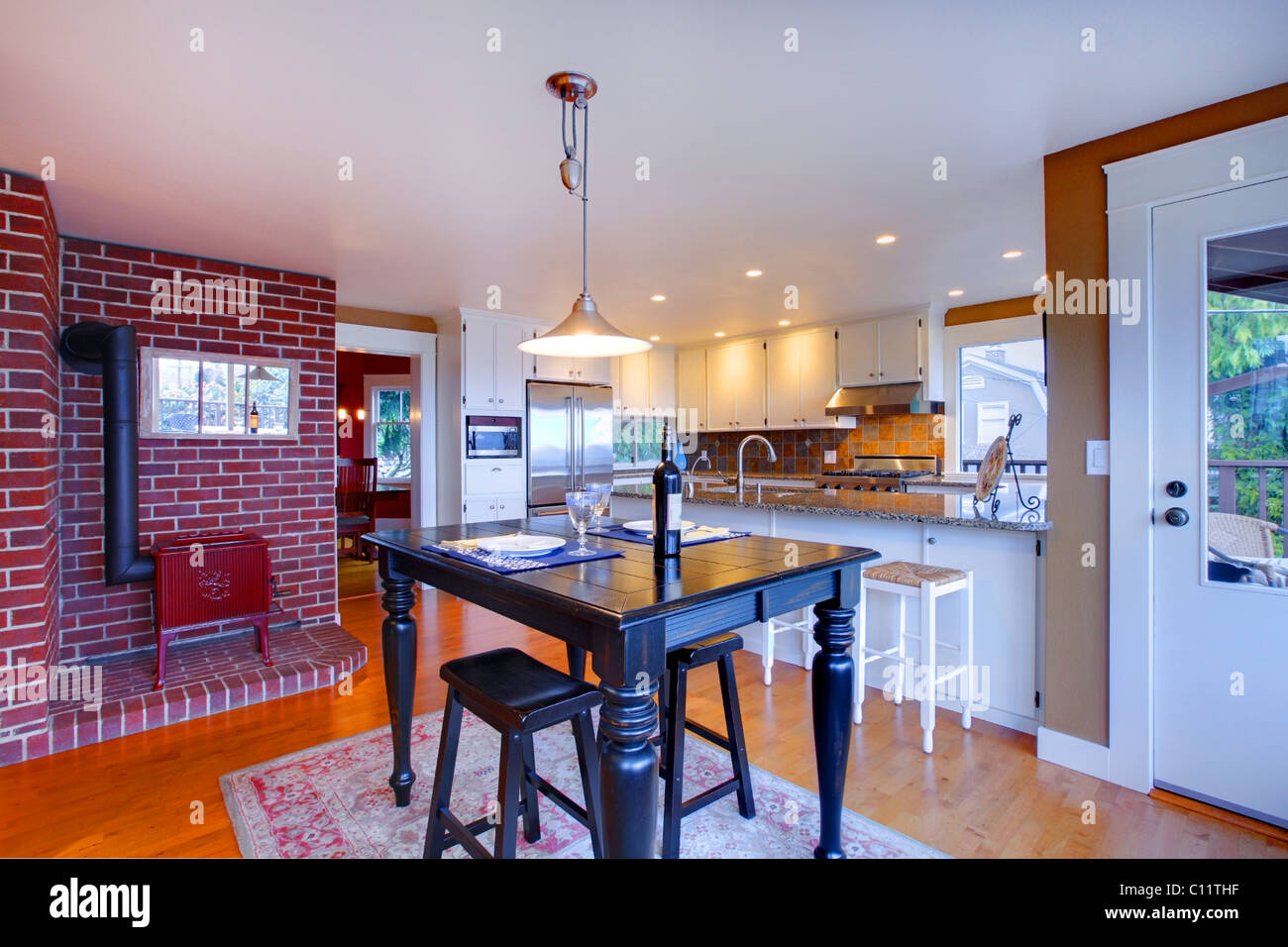 Luxury white kitchen, oak floors and beautiful granite Stock Photo