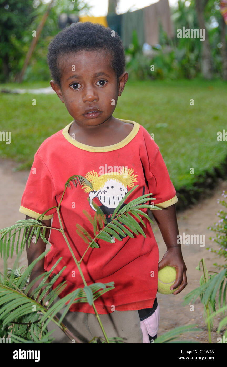 Dani boy in a T-shirt, Wamena, Irian Jaya or West Papua, New Guinea, Indonesia, Southeast Asia Stock Photo