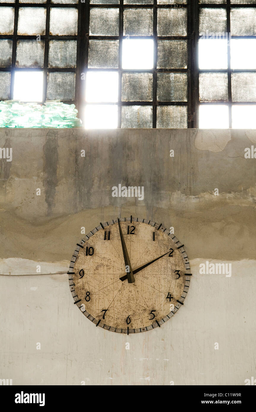 Old clock in a factory Stock Photo