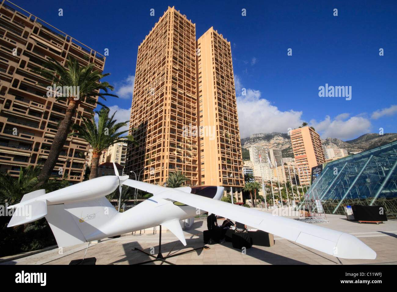 Small aircraft of the brand Visa Airplanes in front of the Grimaldi Forum, skyscrapers Columbia Palace and Houston Palace Stock Photo