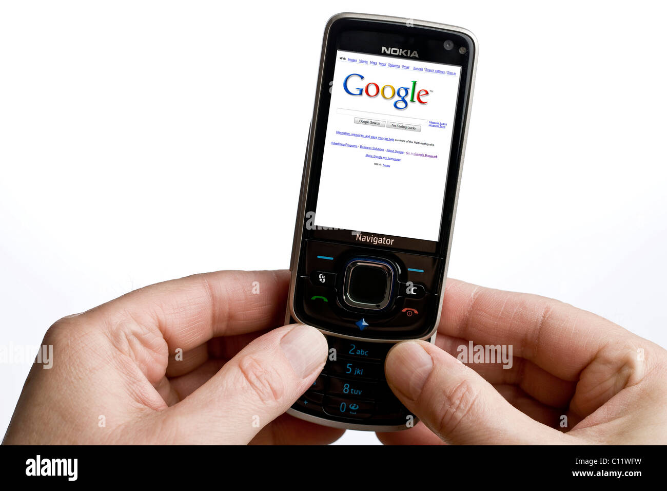 Using Google on a mobile phone Stock Photo
