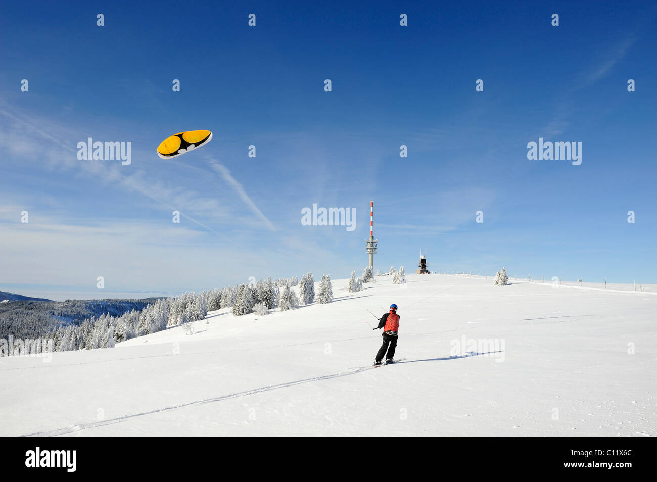 Snowkiting on Mt. Feldberg, in the back the new Feldbergturm antenna, Landkreis Breisgau-Hochschwarzwald district Stock Photo