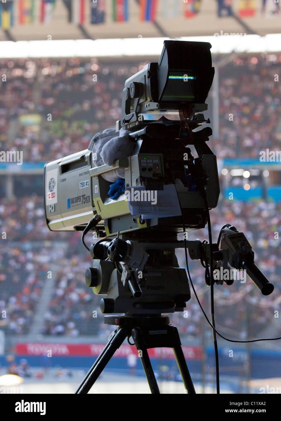 Film camera on a tripod at a sporting event in the Olympic Stadium in Berlin, Germany, Europe Stock Photo