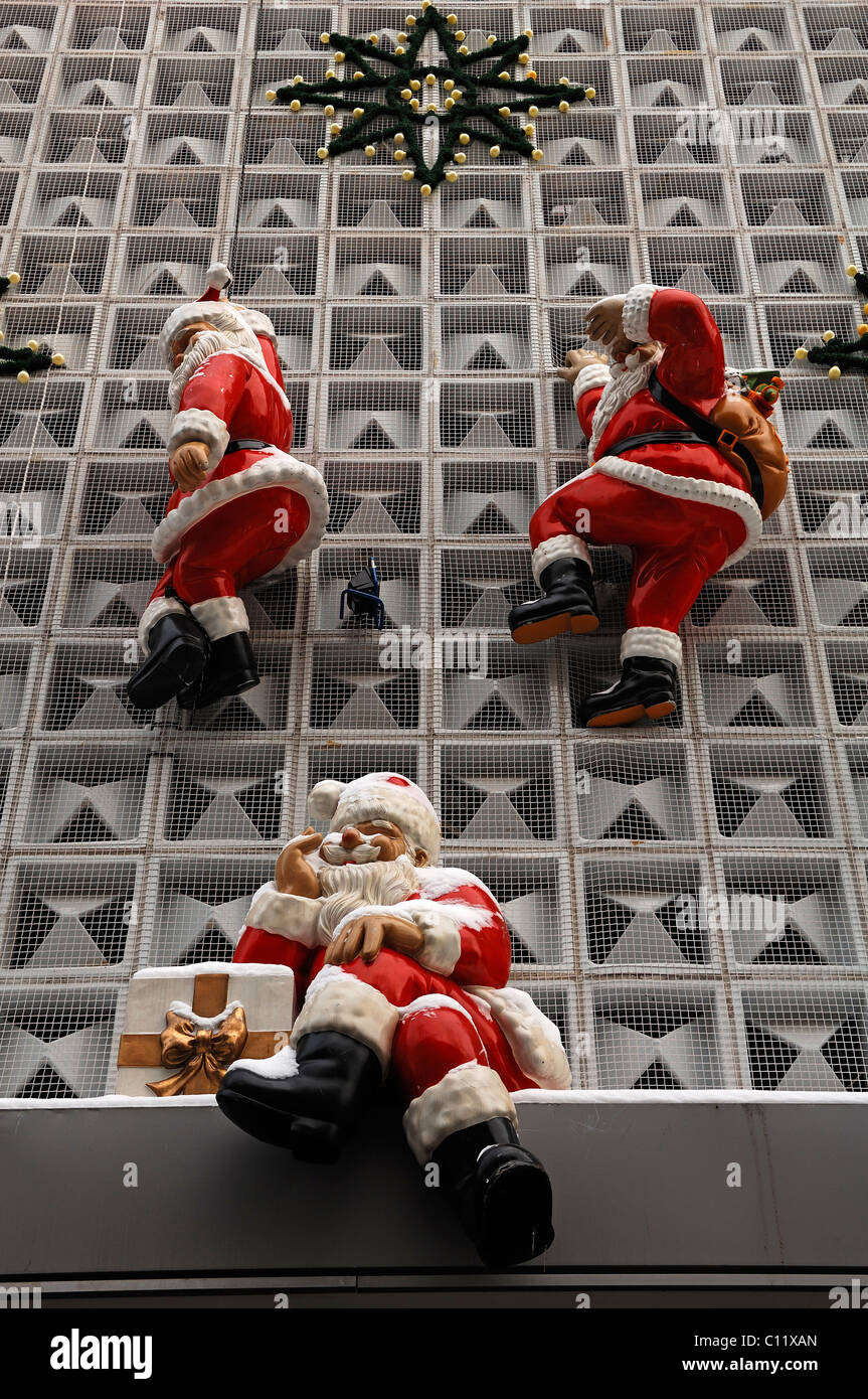 Santa Claus figurines on the facade of a department store, Erlangen, Middle Franconia, Bavaria, Germany, Europe Stock Photo