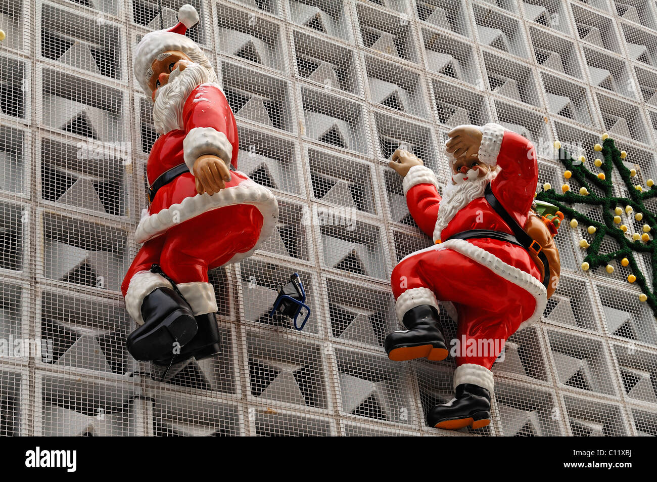 Santa Claus figurines on the facade of a department store, Erlangen, Middle Franconia, Bavaria, Germany, Europe Stock Photo