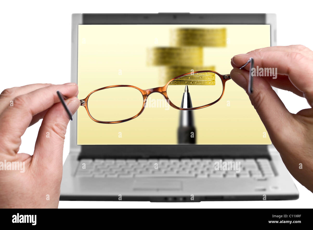Reading glasses in front of a laptop screen Stock Photo - Alamy