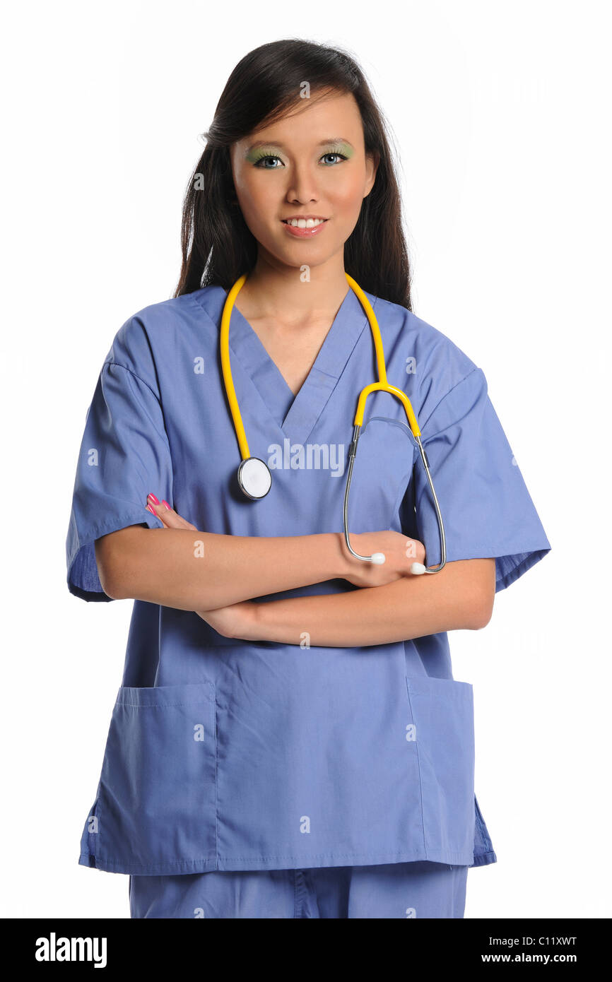 Female doctor or nurse smiling with arms crossed isolated over white background Stock Photo