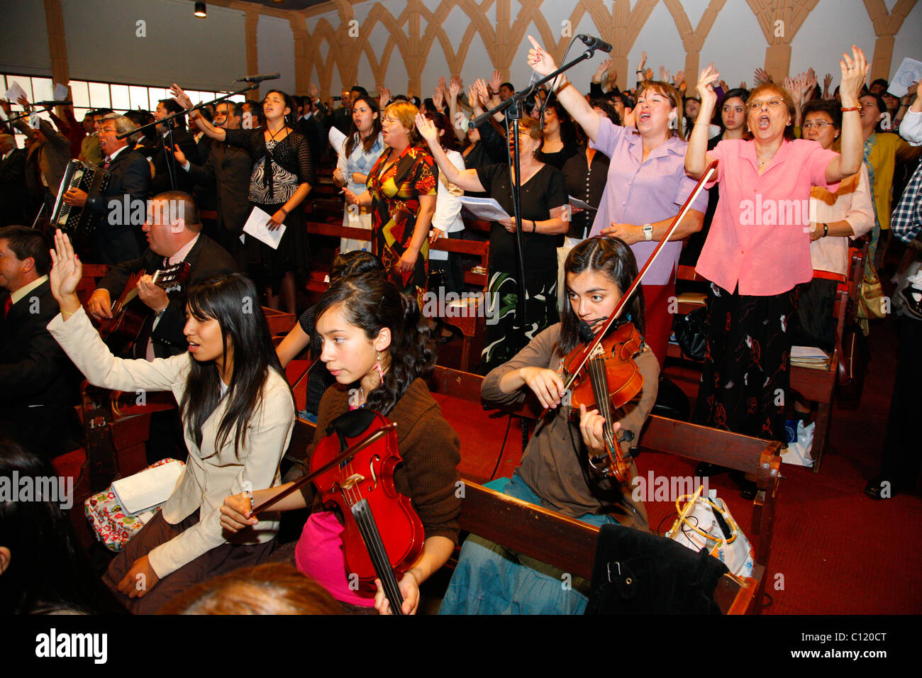 Women making music, worship service, Catedral Evangelica de Chile, Pentecostal Church, Santiago de Chile, Chile, South America Stock Photo