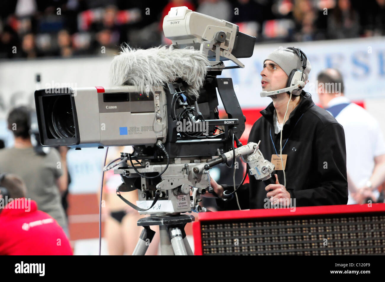 Cameraman at a live broadcast, top-class athletics, Sparkassen-Cup 2010 sports tournament, Hanns-Martin-Schleyer-Halle stadium Stock Photo