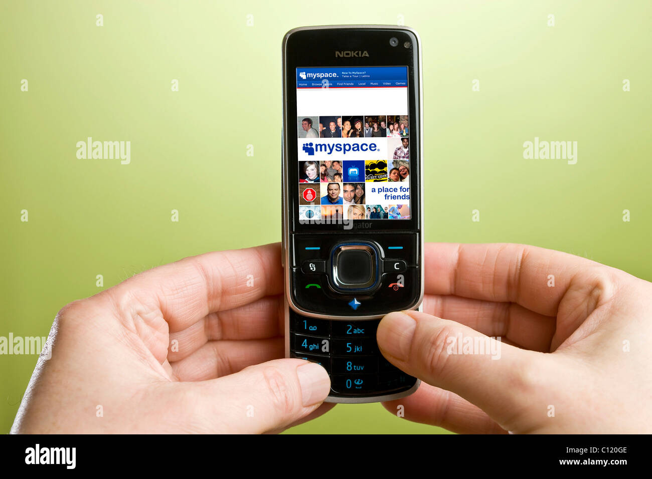 Using Myspace on a mobile phone Stock Photo