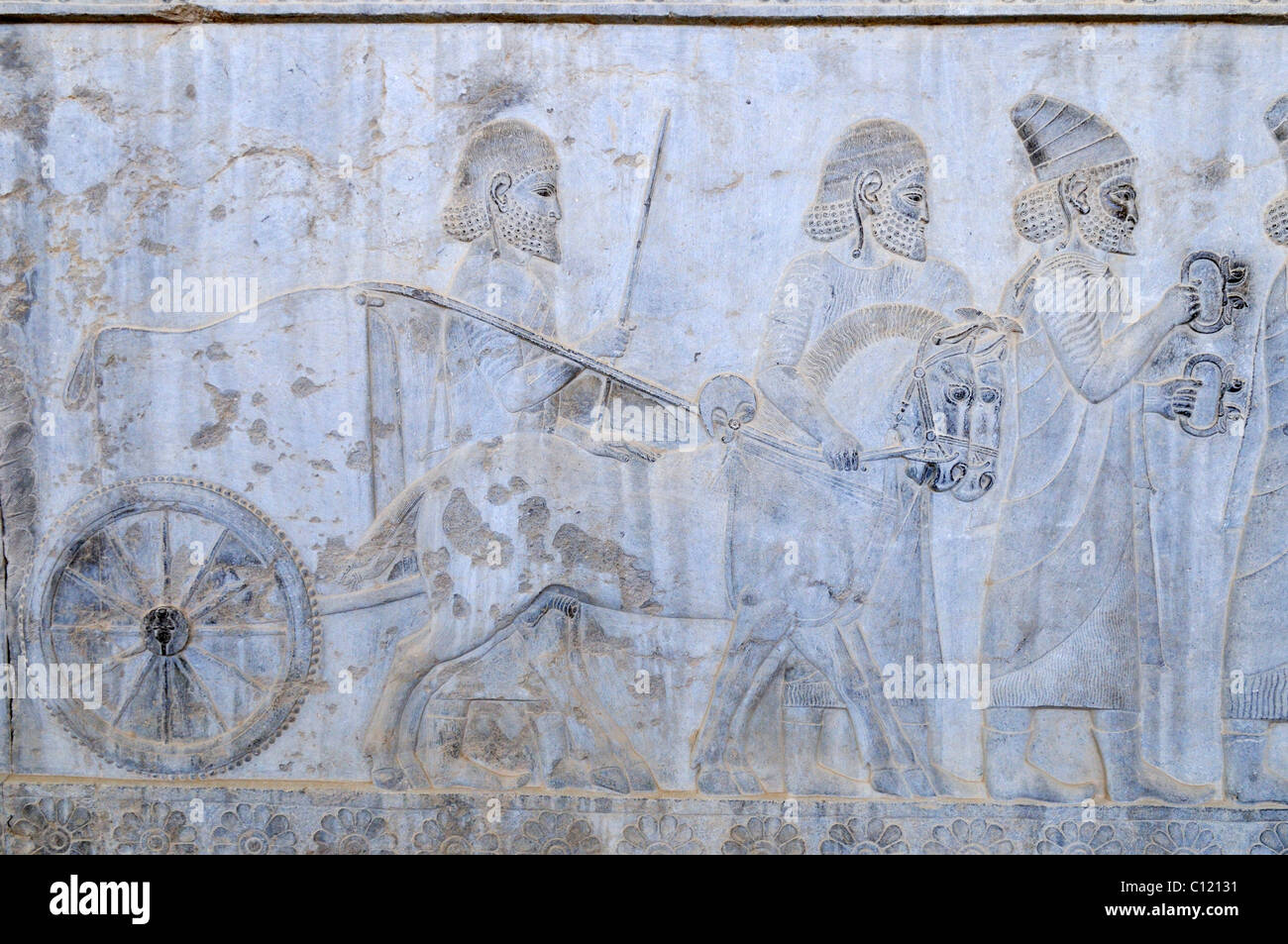 Famous bas-relief with chariot on the Apadana Palace, Achaemenid archeological site of Persepolis, UNESCO World Heritage Site Stock Photo