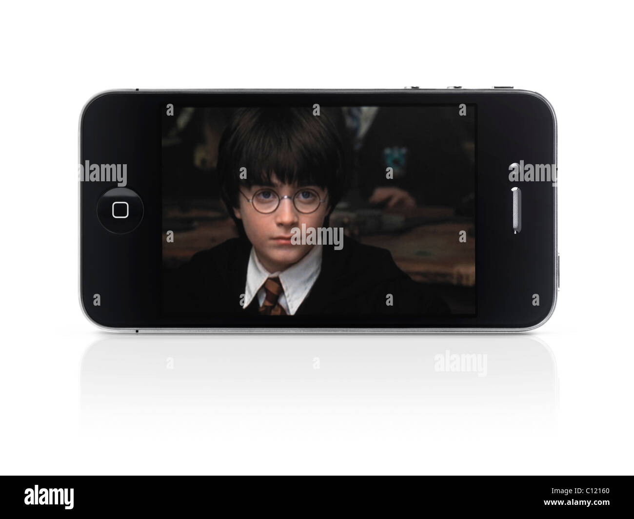 Harry Potter movie on display of Apple iPhone 4 smartphone isolated with clipping path on white background Stock Photo
