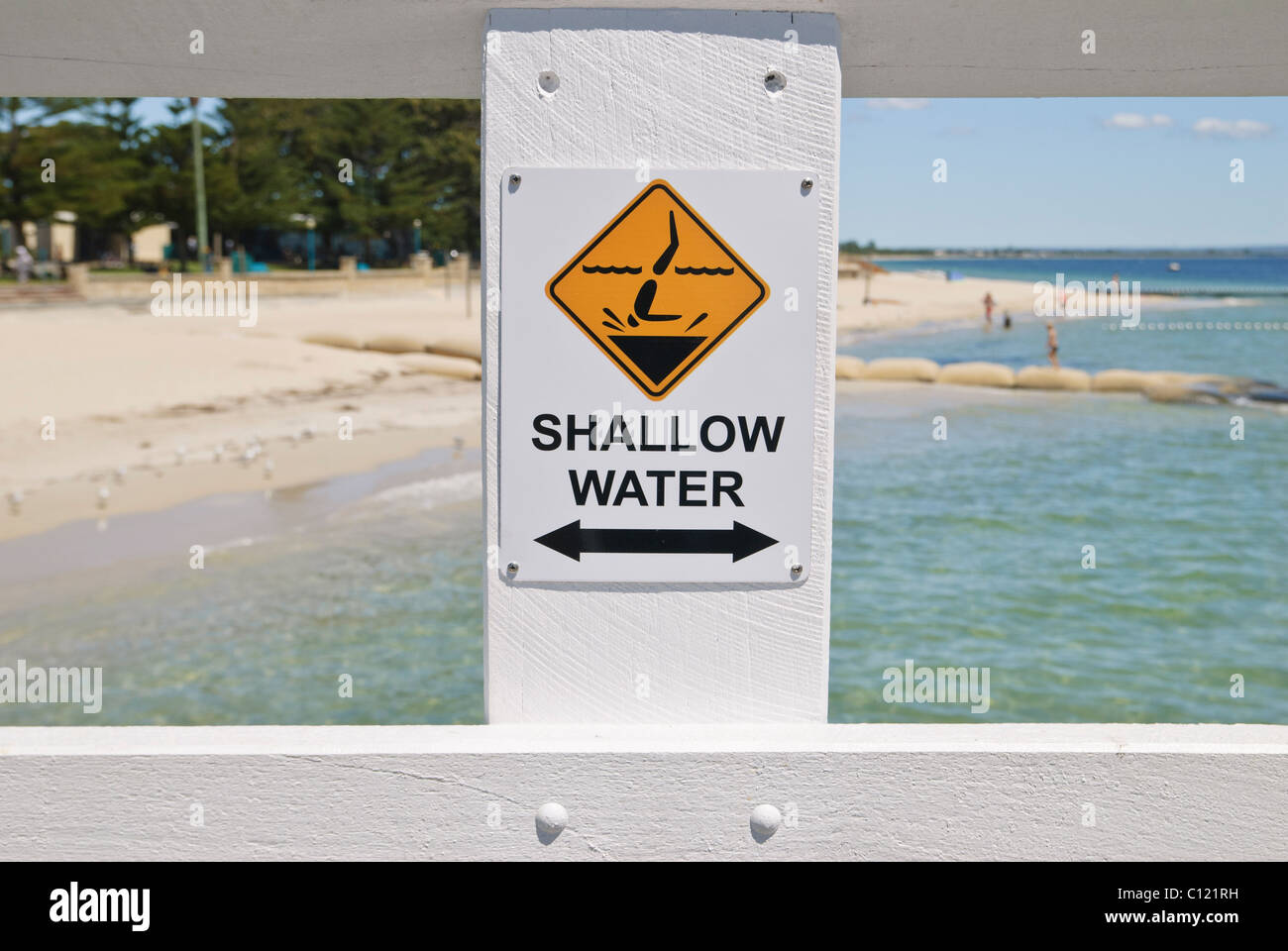 Selective focus on shallow water sign indicating that it is dangerous to dive in, Busselton, Western Australia Stock Photo