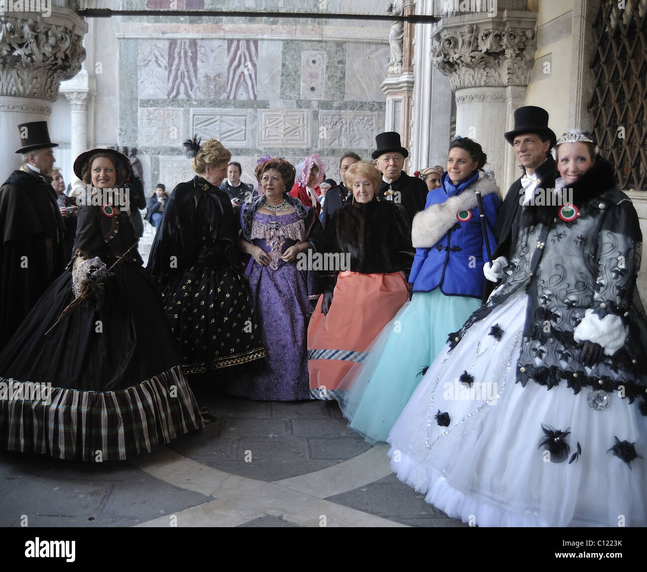 Members of the association 'Amici del Carnevale di Venezia' wearing 19th century costumes pose in St Mark Square Stock Photo
