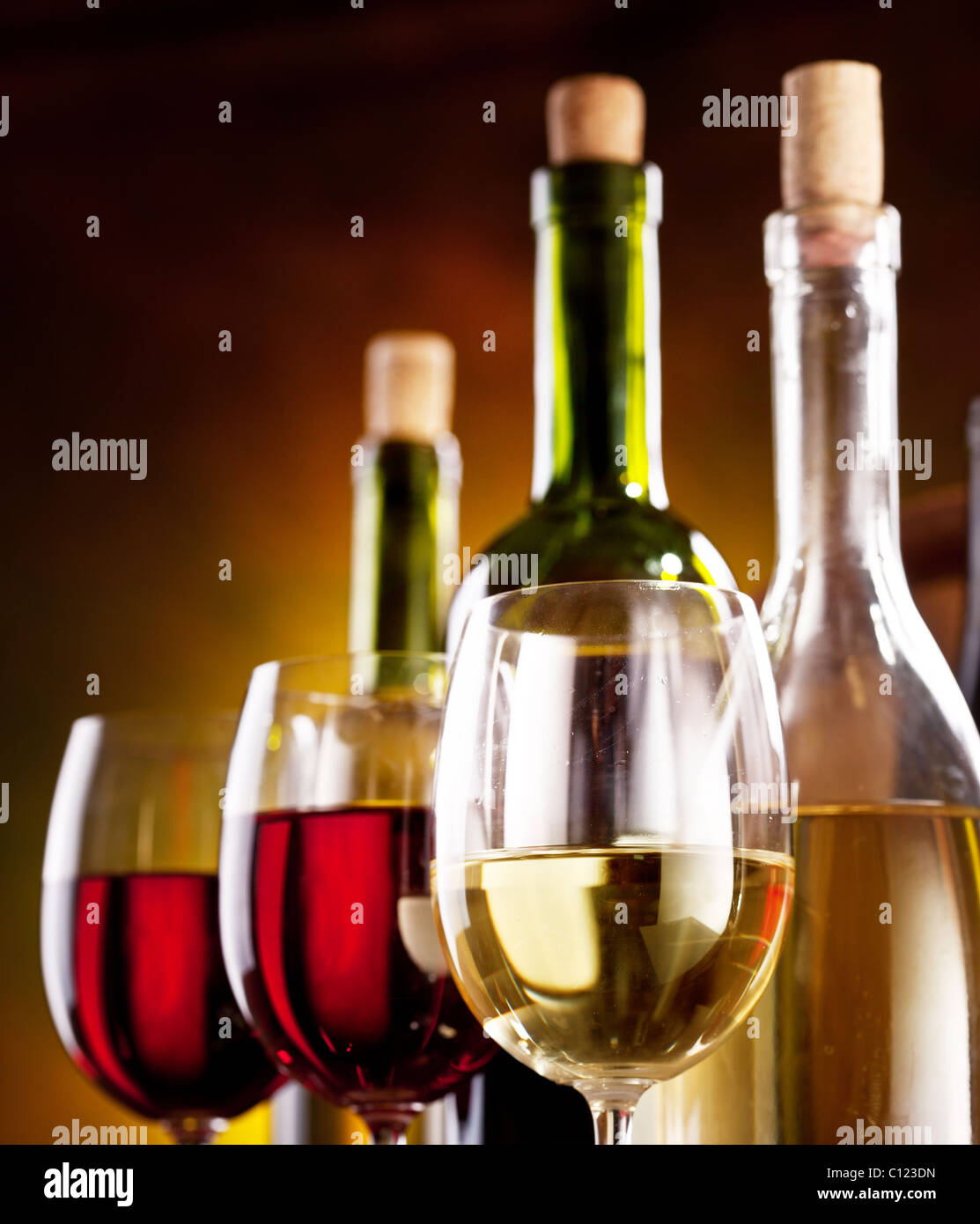 Still life with wine bottles, glasses and oak barrels Stock Photo - Alamy