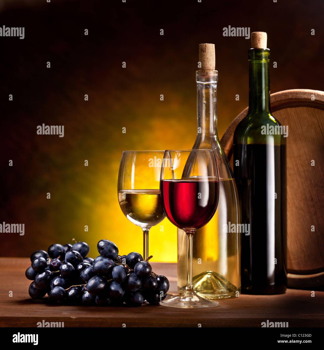 Still life with wine bottles, glasses and oak barrels Stock Photo Alamy