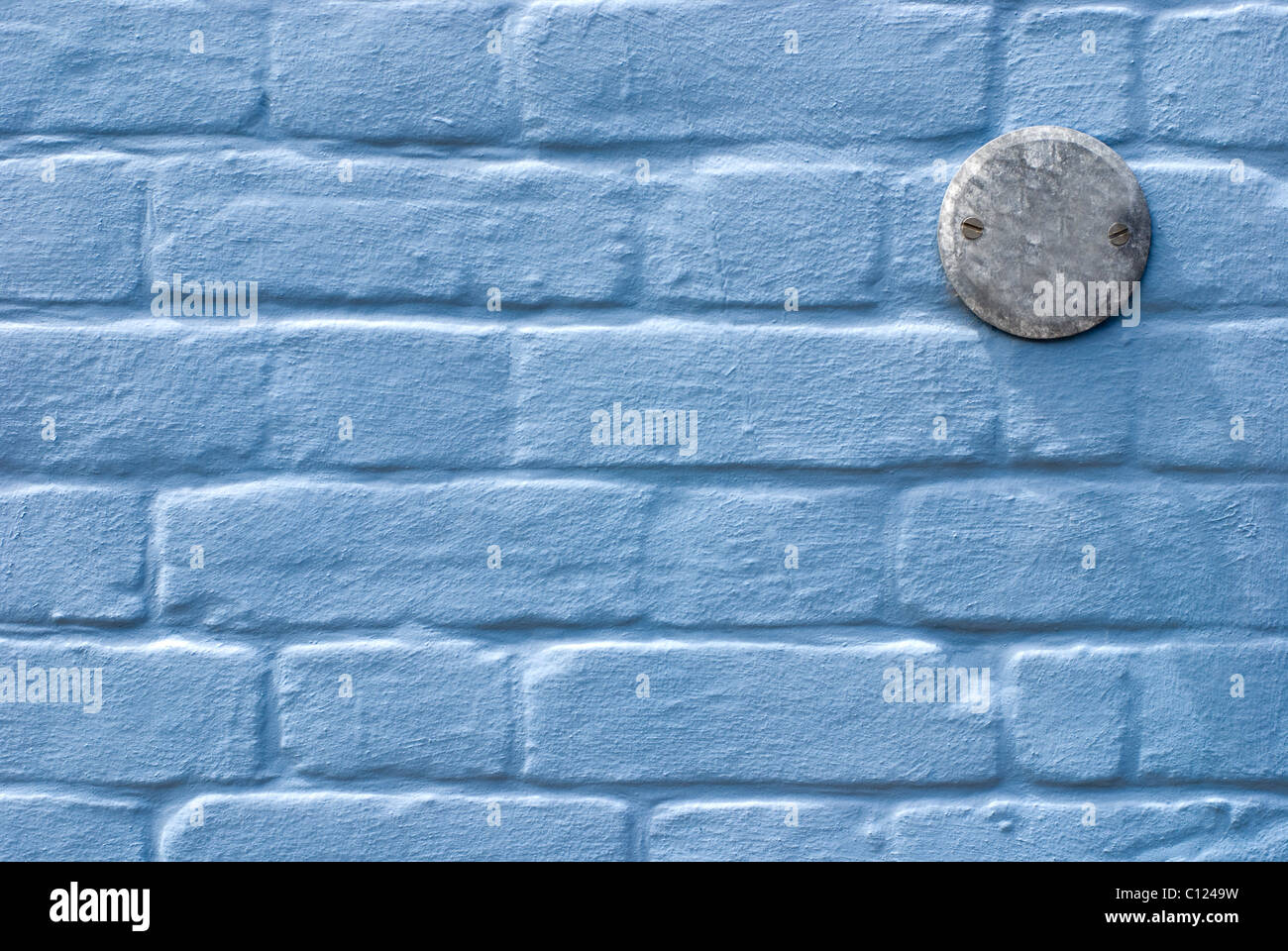 Blue wall with number plate. Suffolk. England. Stock Photo