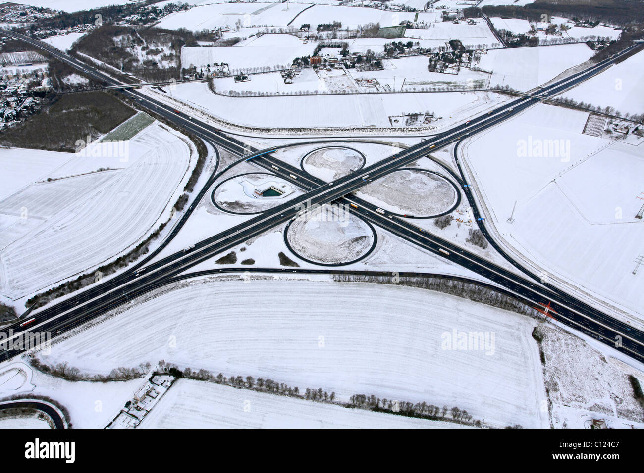 Aerial view, Kamener Kreuz motorway junction of the A1 and A2 motorways in the snow, reconstruction, Kamen, Ruhrgebiet region Stock Photo