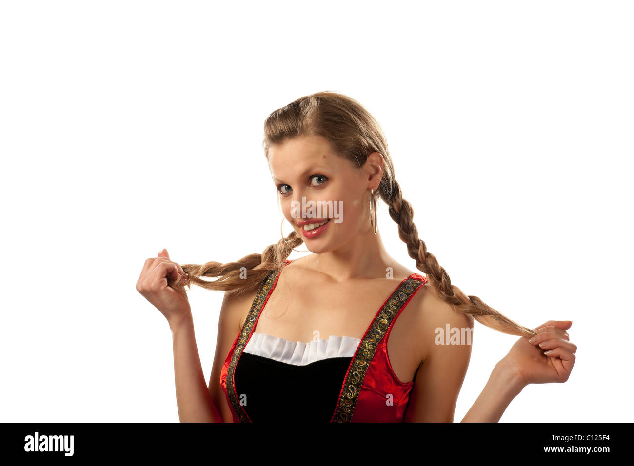 Young woman, 24 years old, with braids, in a short dirndl, cheeky Stock Photo