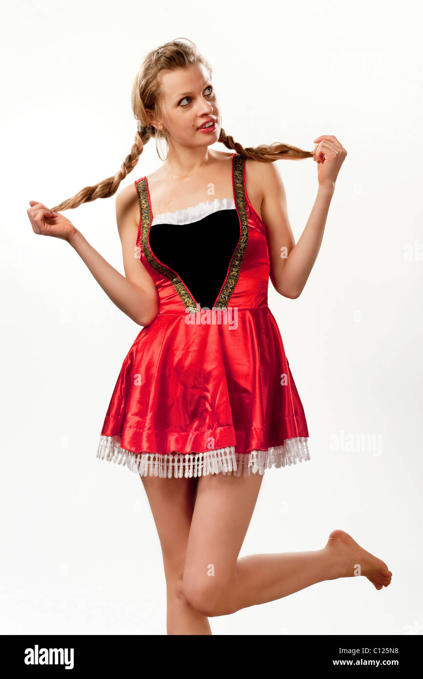 Young woman, 24 years old, with braids, in a short dirndl Stock Photo