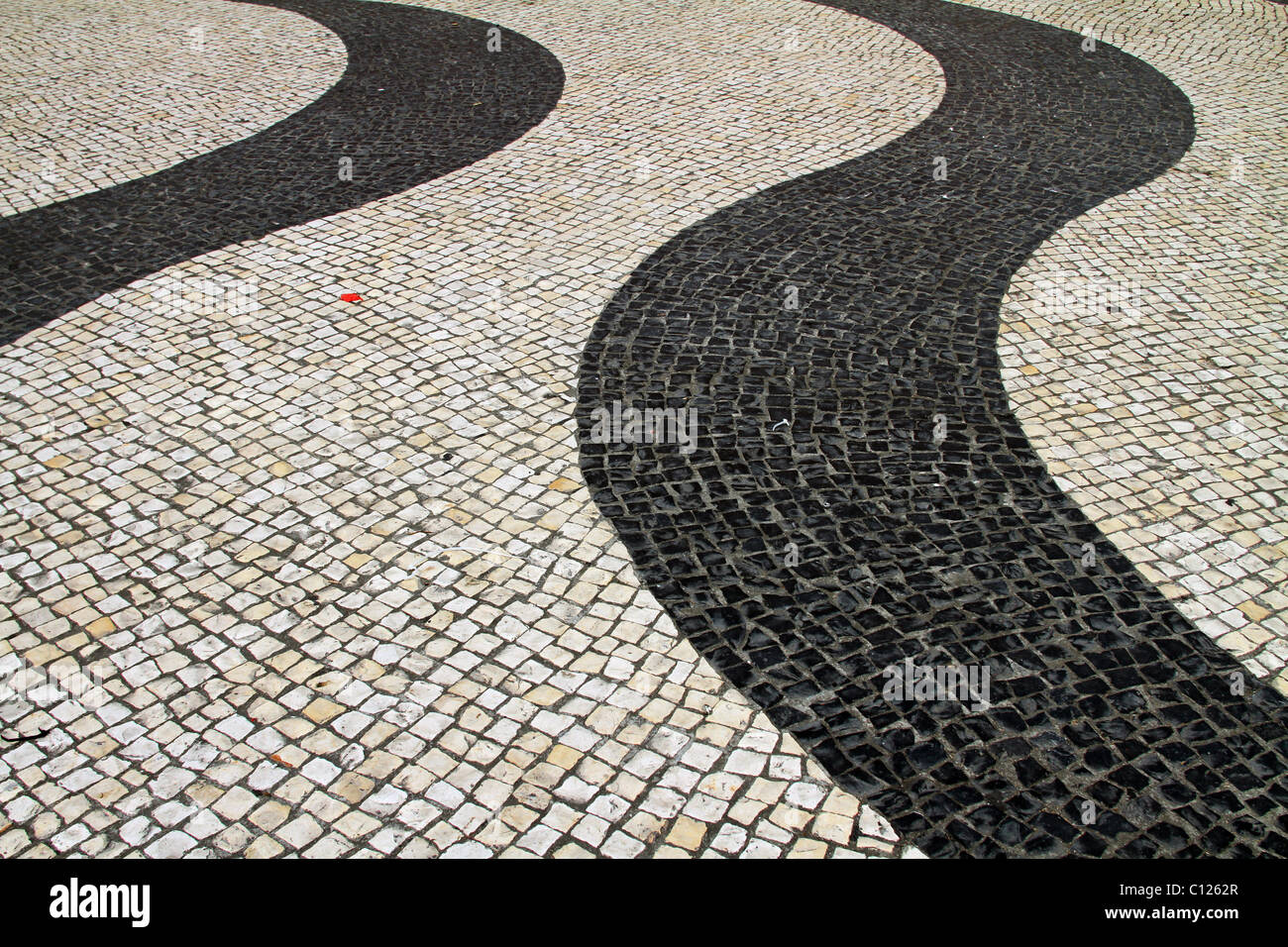 Wavy lines in mosaic paving stones in the Largo do Senado, the Senate Square in Macau, China. Stock Photo