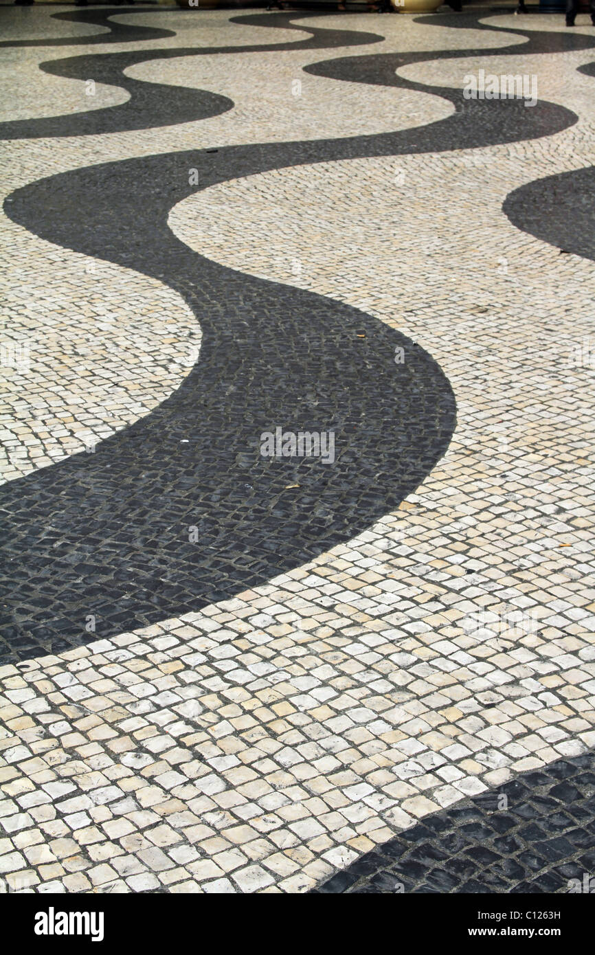 Wavy lines in mosaic paving stones in the Largo do Senado, the Senate Square in Macau, China. Stock Photo