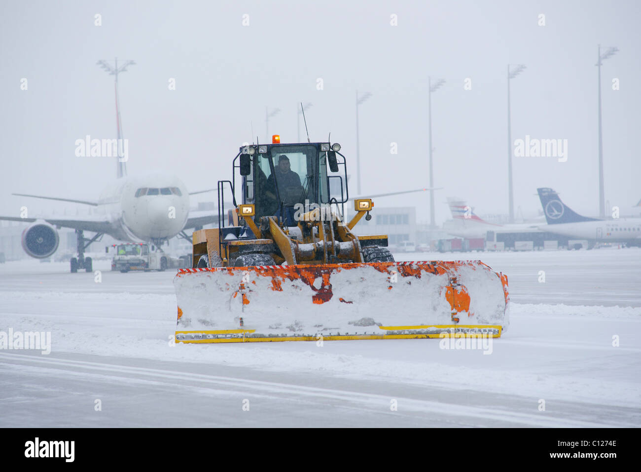 Airport snowplow hi-res stock photography and images - Alamy
