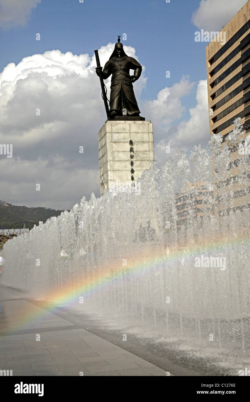 Fountain and rainbow in front of the Admiral Yi Sun Shin statue at Gwanghwamun Plaza in downtown Seoul, South Korea, Asia Stock Photo