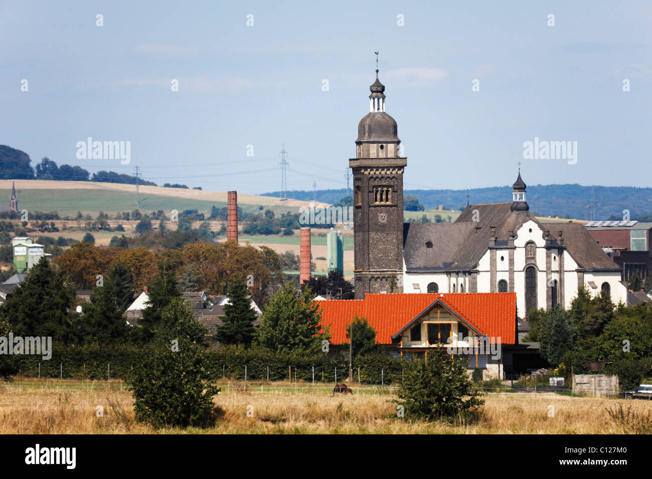 Longshot of the parish church St. Dionysius in Kruft, Mayen-Koblenz, Rhineland-Palatinate, Germany, Europe Stock Photo