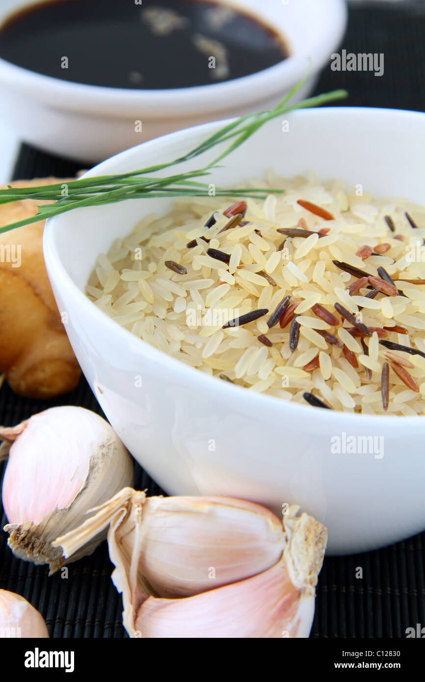 traditional asian ingredients uncooked rice, ginger, garlic, soy sause