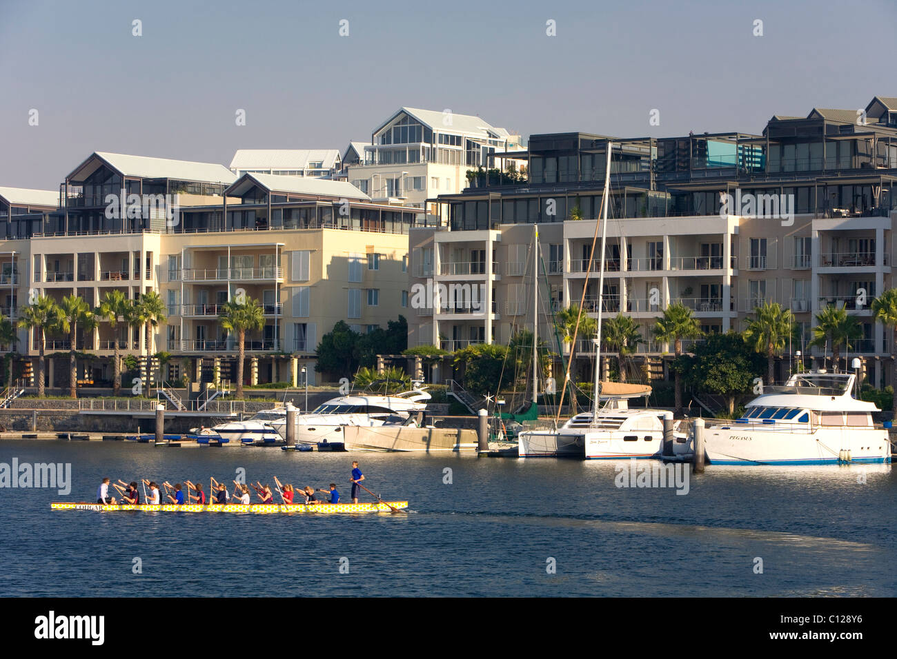 Luxury homes at the Waterfront, in front a luxury yacht, Victoria