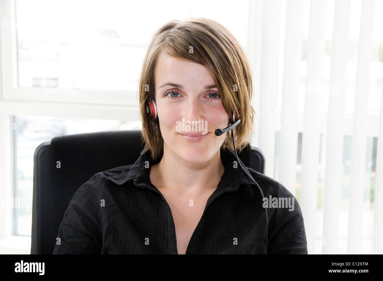Woman with headset Stock Photo