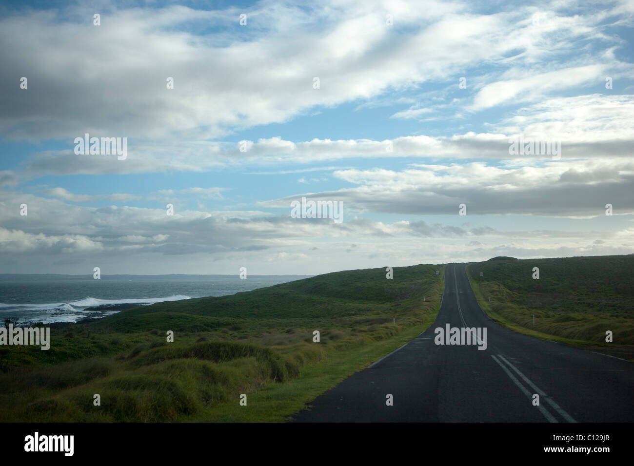 Open road along sea-side. Symbolic of freedom, escape, solitude etc. Stock Photo