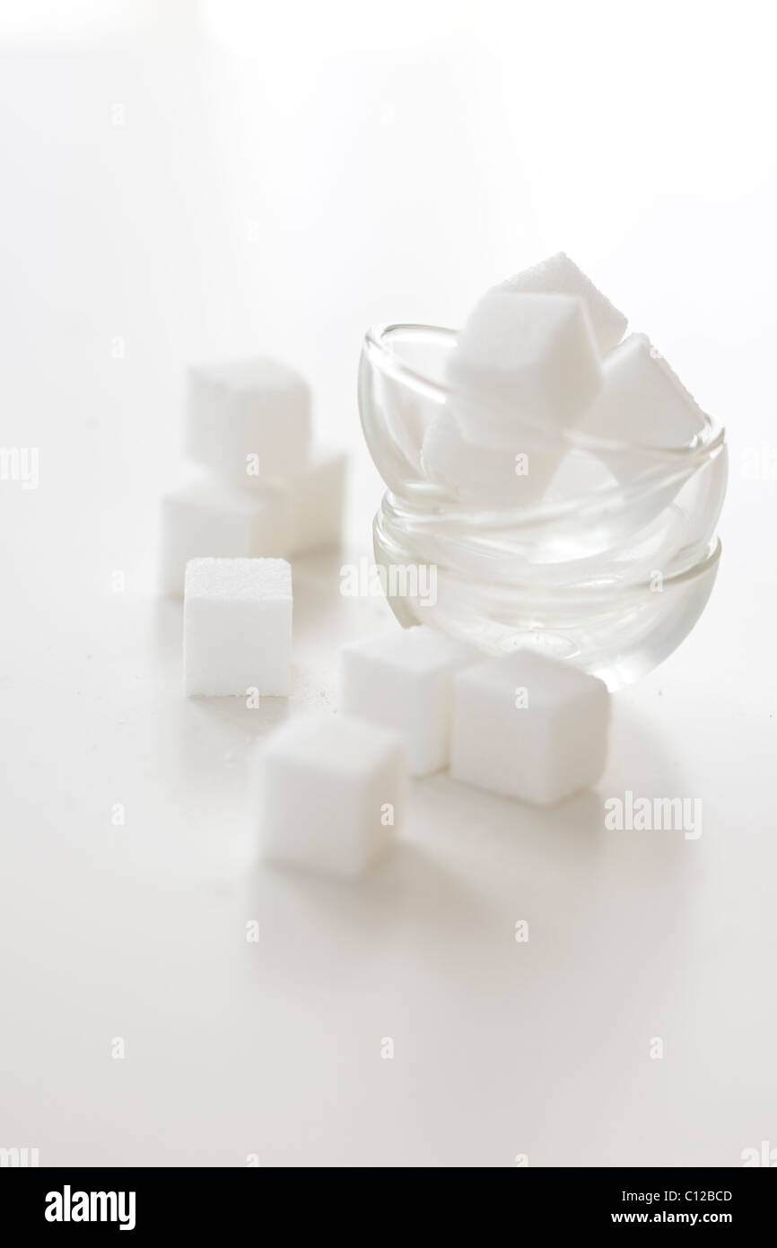 sugar lumps in glass bowls on white Stock Photo