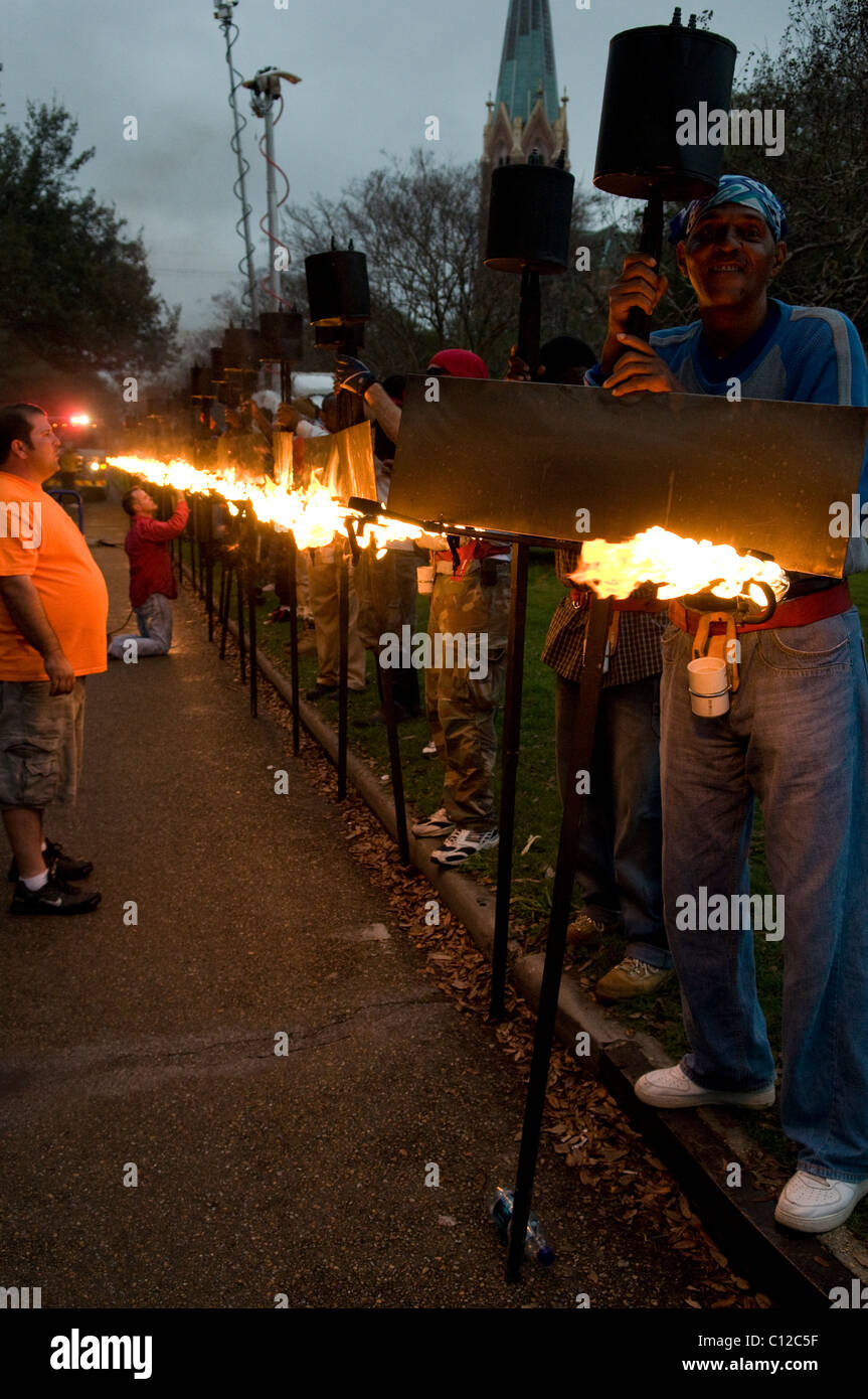 Flambeaux in Hermes, staging area during Mardi Gras 2011 Stock Photo ...