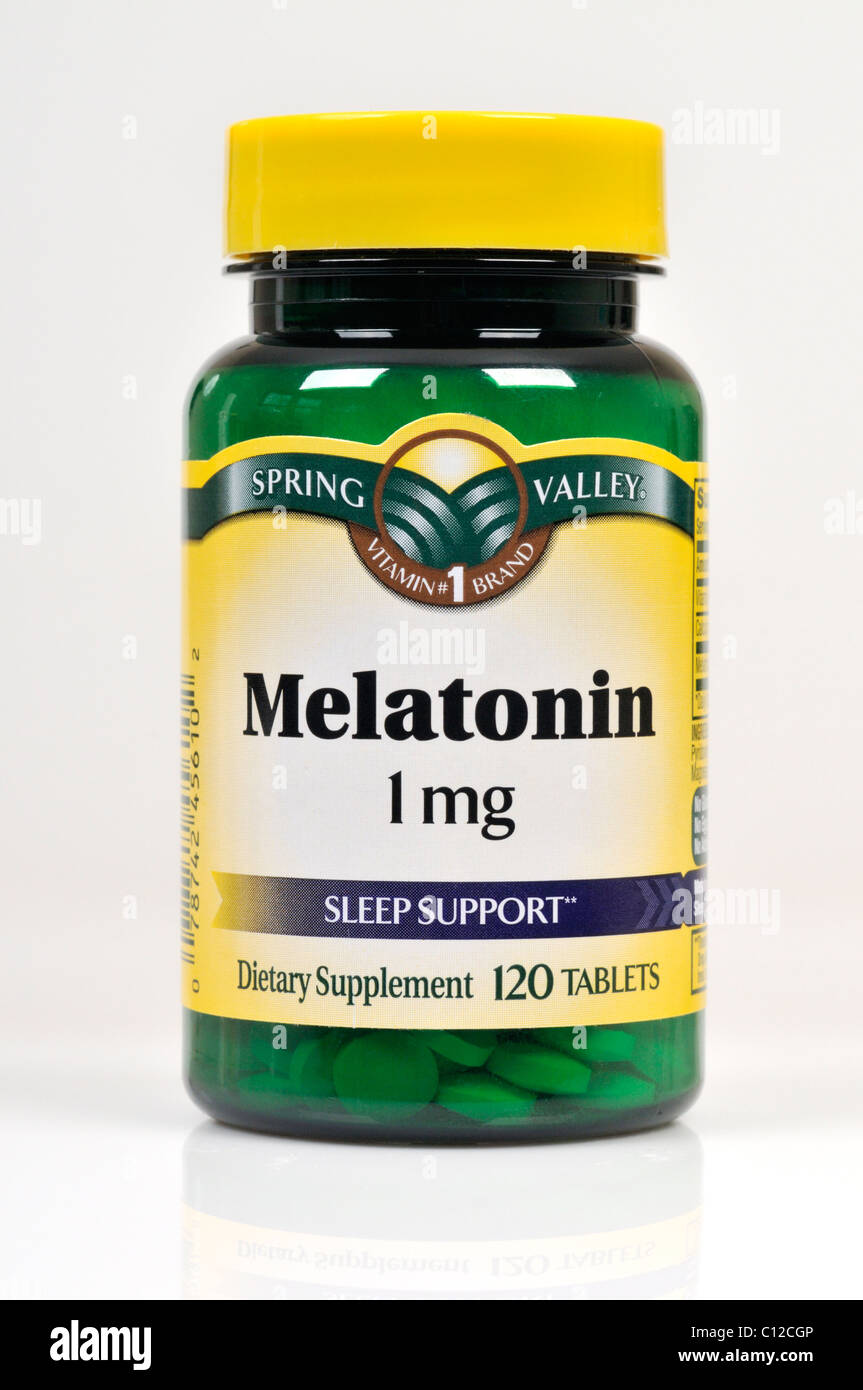 Bottle of Spring Valley Melatonin dietary supplement on white background, cutout. Stock Photo