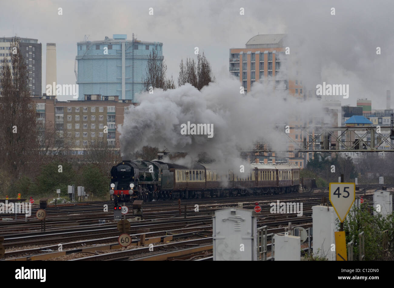 Merchant Navy Class steam engine approaches Clapham Junction Station Stock Photo